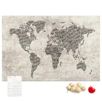 Cork memo board with newspaper world map print