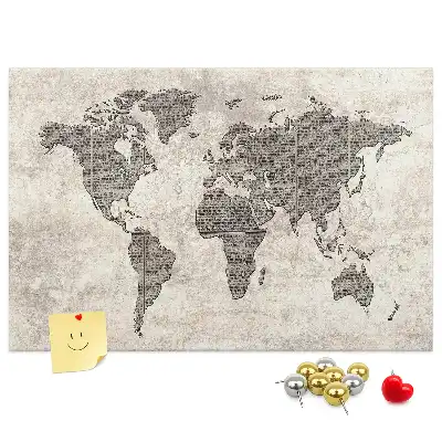Cork memo board with newspaper world map print