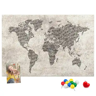 Cork memo board with newspaper world map print