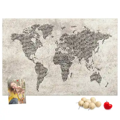 Cork memo board with newspaper world map print