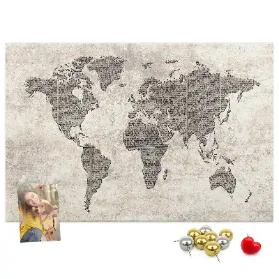 Cork memo board with newspaper world map print