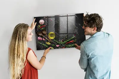 Magnetic glass dry erase board featuring spices on the counter