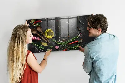 Magnetic glass dry erase board featuring spices on the counter