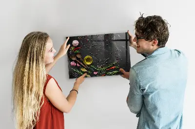 Magnetic glass dry erase board featuring spices on the counter