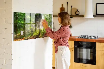 Magnetic glass dry erase board featuring a forest sunrise
