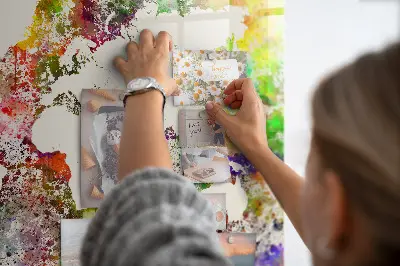 Magnetic wall board with a watercolor world map