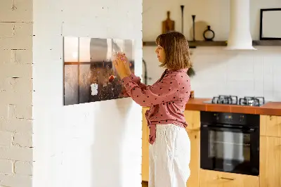 Magnetic glass dry erase board featuring a sunrise field design