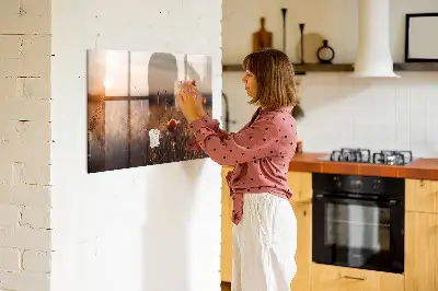 Magnetic glass dry erase board featuring a sunrise field design