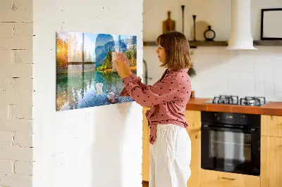 Magnetic wall board featuring a river and mountain landscape